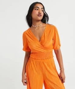 ARIANA PLISSE PLEATED WRAP TOP